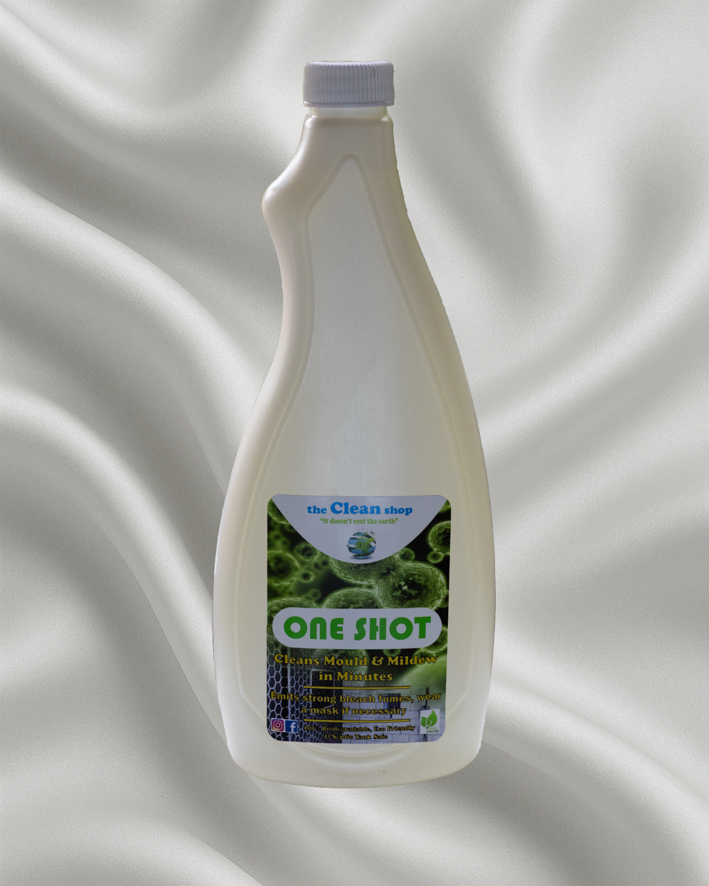 Bottle of 'One Shot' cleaning solution on a textured white background