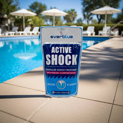 Everblue Active Shock pool treatment package by a pool with umbrellas in the background