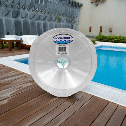 clear vac lid on a wooden deck with a pool in the background