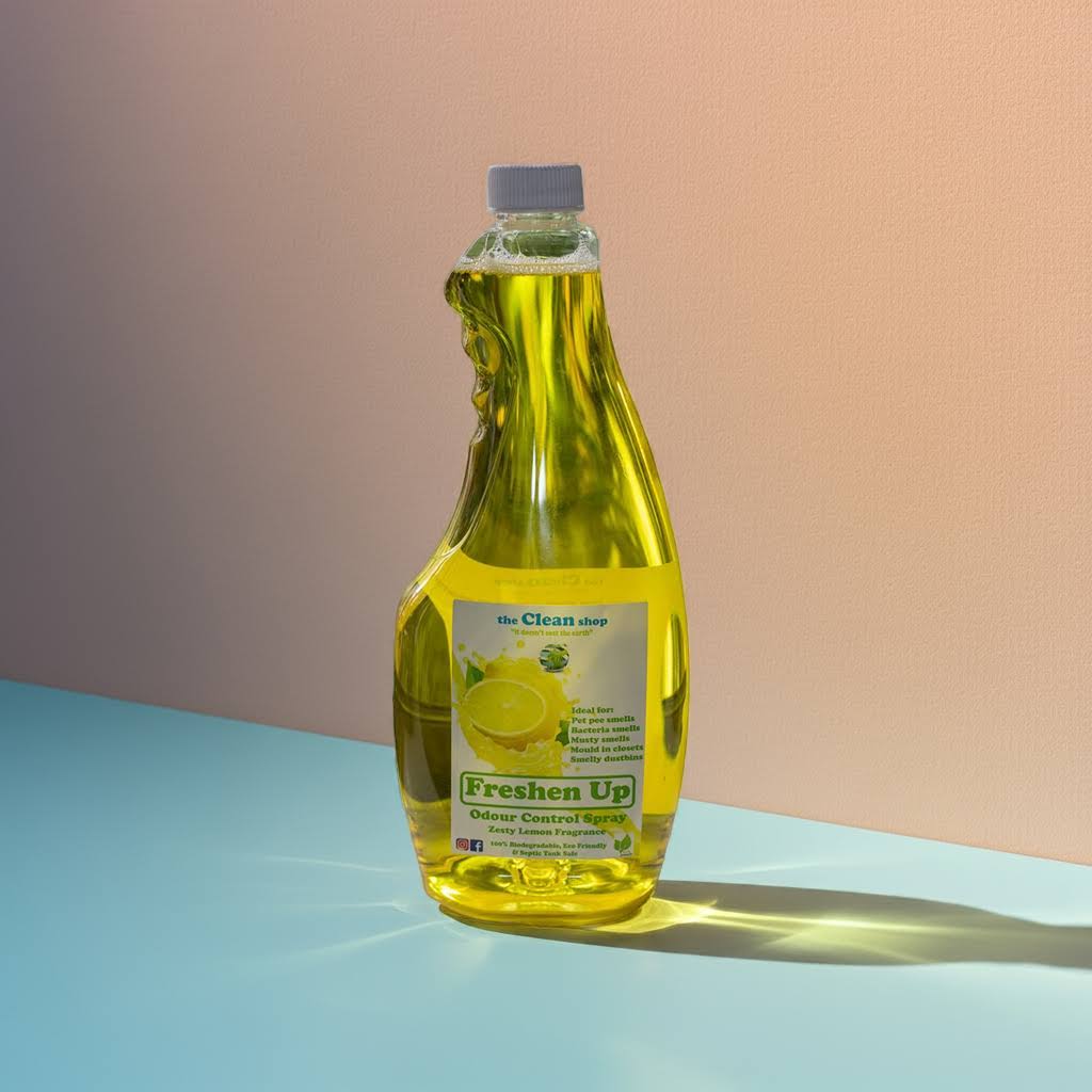 Bottle of cleaning solution labeled 'Freshen Up' on a gradient background