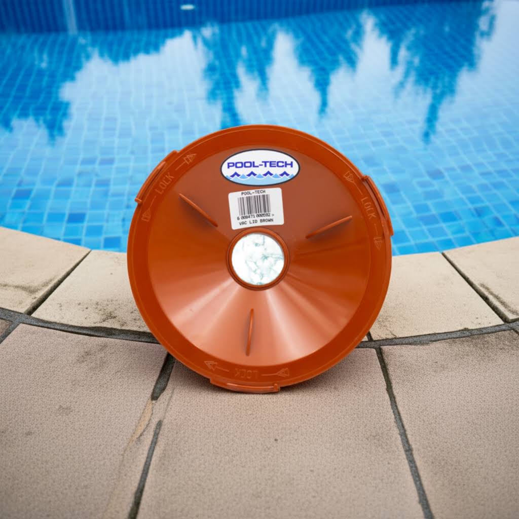 Orange pool filter with 'Pool-Tech' branding by a swimming pool.