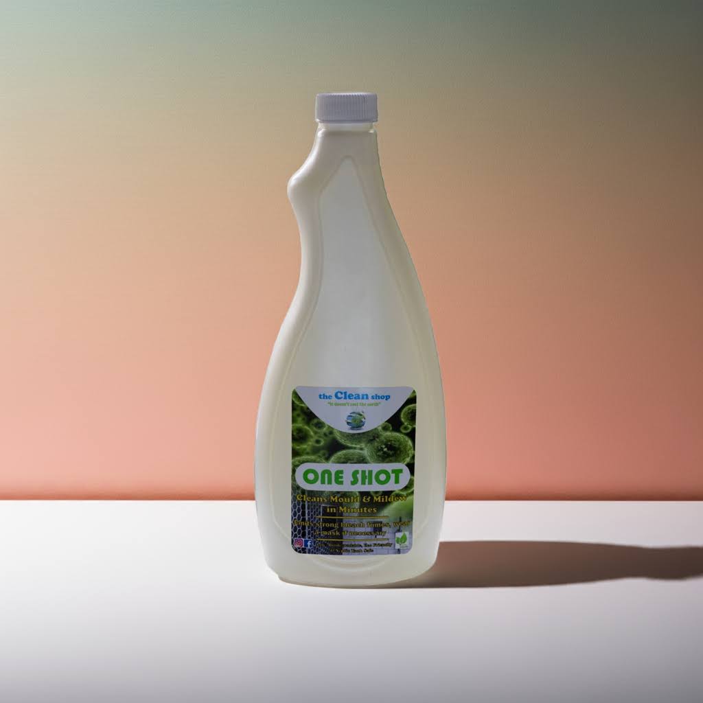 Bottle of 'One Shot' cleaning solution on a gradient background