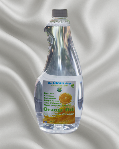 Bottle of orange oil multi-purpose cleaner with a gray background
