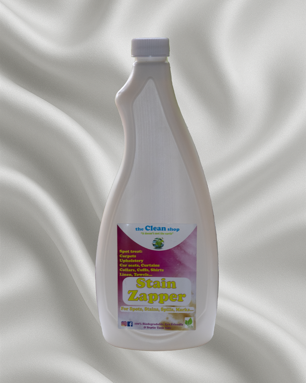 Bottle of Stain Zapper on a textured gray background